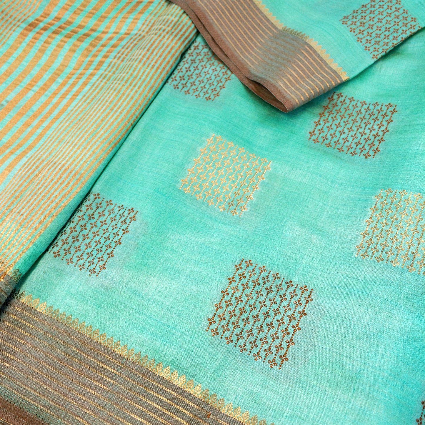 Pale Turquoise Semi Raw Silk Saree with Gold & Copper Zari Motifs